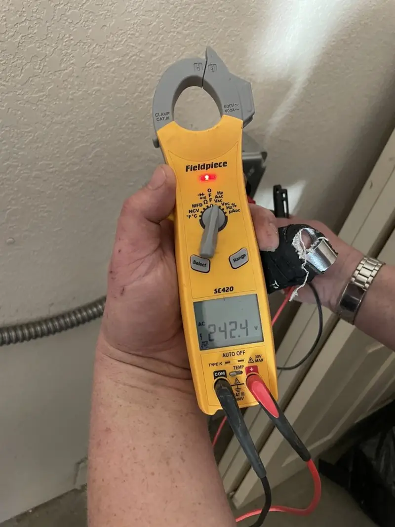 Voltage testing with clamp meter during Electrical Installation Services in Harwich